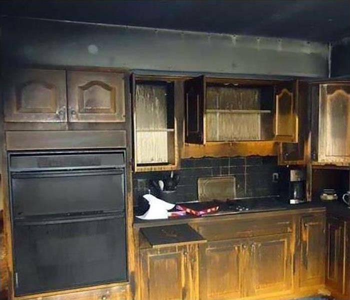 kitchen covered in soot after a fire